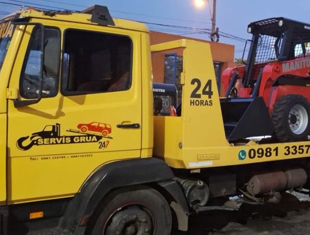 Imagen de grúa asistiendo vehículo